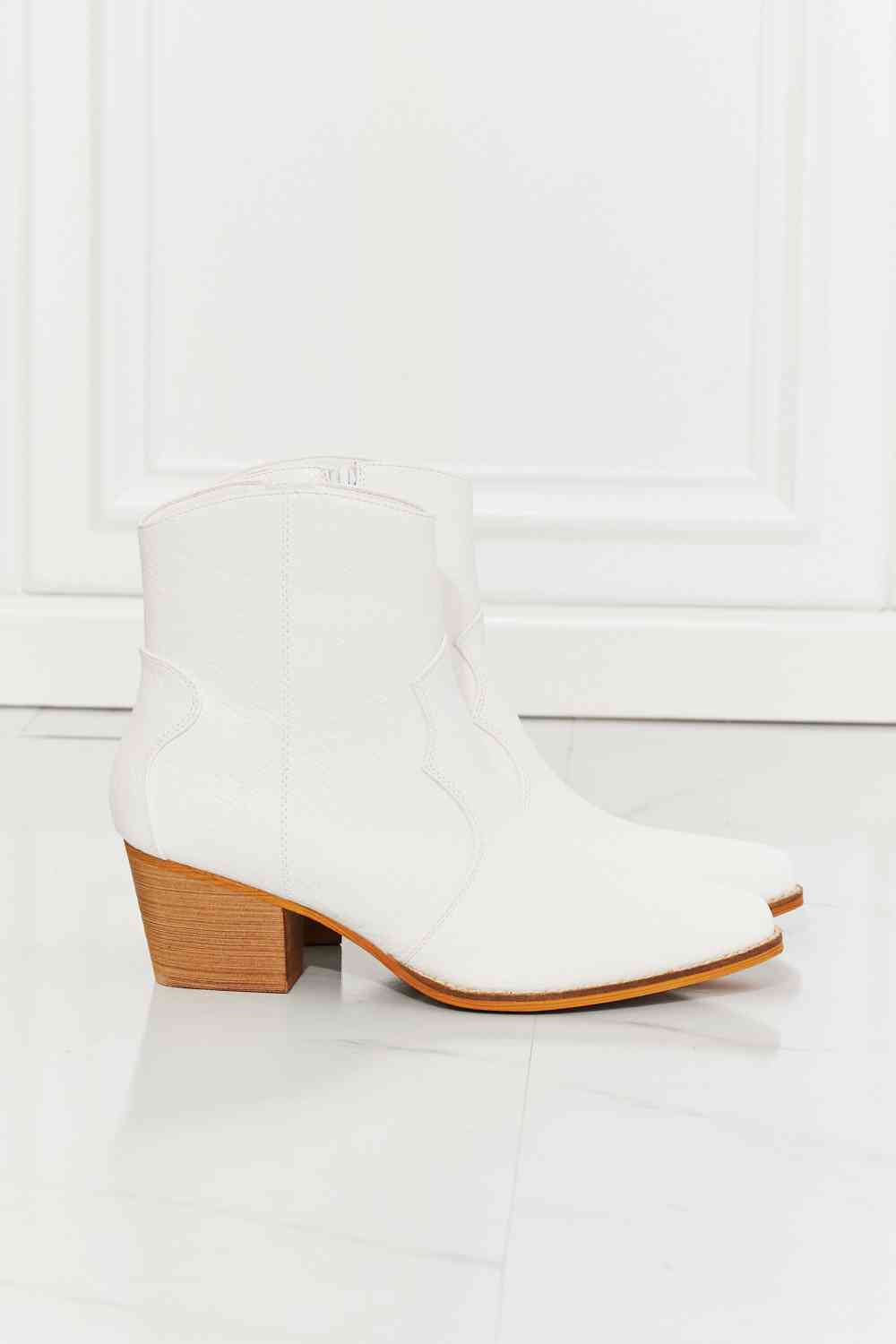 MMShoes Watertower Town Faux Leather Western Ankle Boots in WhiteThese Western-inspired booties feature a stacked heel and a faux leather upper. Their pointed toe adds a refined detail, making these a perfect choice to finish any chelsea boots womenchelsea boots women