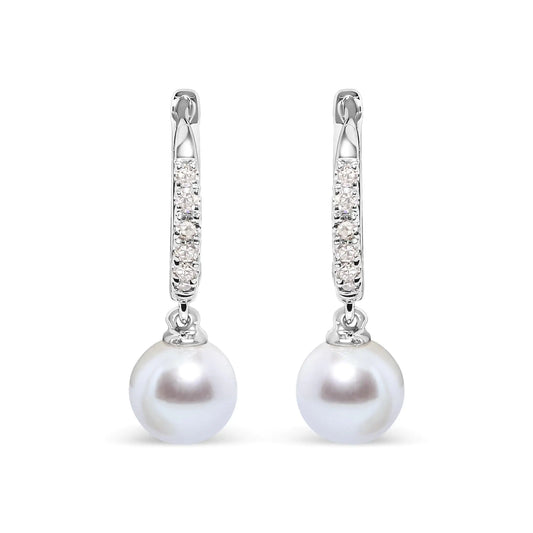 10K white gold drop earrings featuring 6x6 MM cultured freshwater pearls and diamond accents.