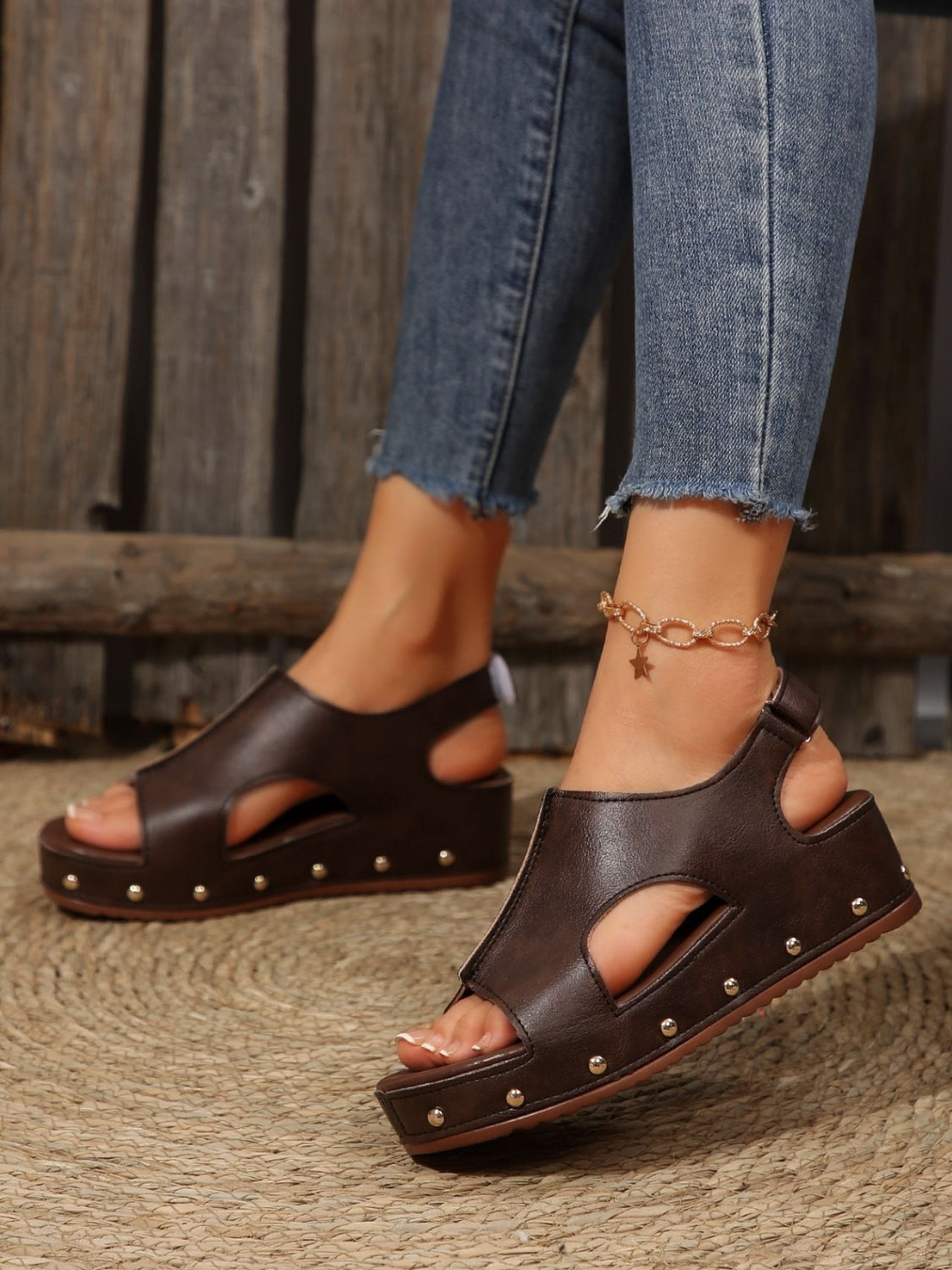 PU Leather Studded Wedge SandalsIncludes: Box not included
Heel height: Flats
Material: Rubber, PU
Imported
Product Measurements (Measurements by inches) &amp; Size Conversion

Size
Foot length


3PU Leather Studded Wedge SandalsPU Leather Studded Wedge Sandals