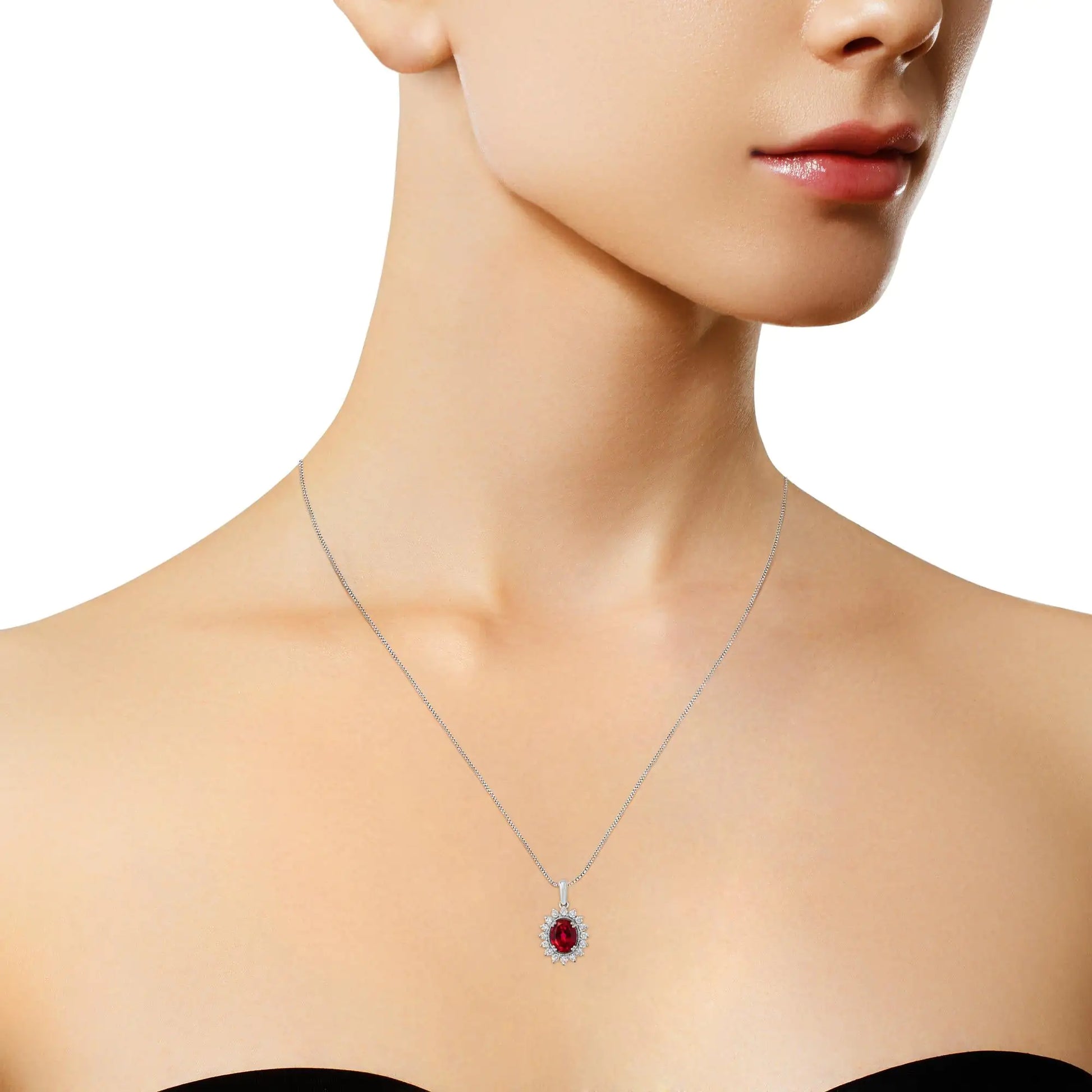 10K White Gold Created 9MM Ruby Gemstone and Natural Diamond Pendant NA delicate box chain holds a breathtaking oval ruby halo pendant. The dazzling 9MM oval cut red ruby gemstone is enhanced by a halo of 1/2ct round cut diamonds. The 10K White Gold Created 9MM Ruby GemstoneNecklace10K White Gold Created 9MM Ruby Gemstone