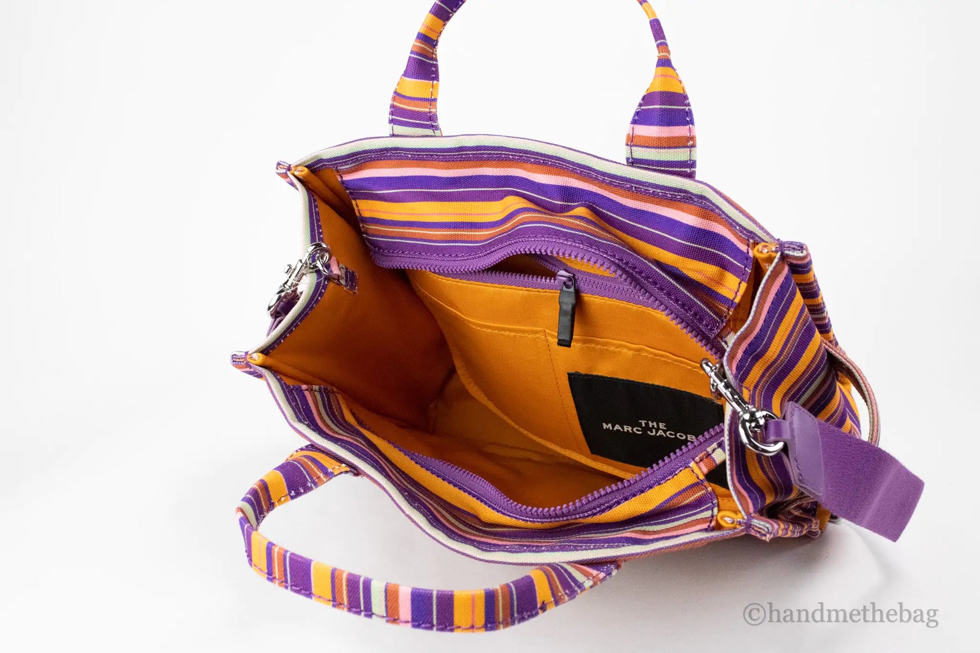 Marc Jacobs The Striped Traveler Tote Medium Purple Cotton Canvas HandMarc Jacobs The Striped Traveler Tote – Medium Purple Cotton Canvas Handbag﻿Add a pop of color to your wardrobe with Marc Jacobs The Striped Traveler Tote in medium Striped Traveler Tote Medium Purple Cotton Canvas Handbag PurseStriped Traveler Tote Medium Purple Cotton Canvas Handbag Purse