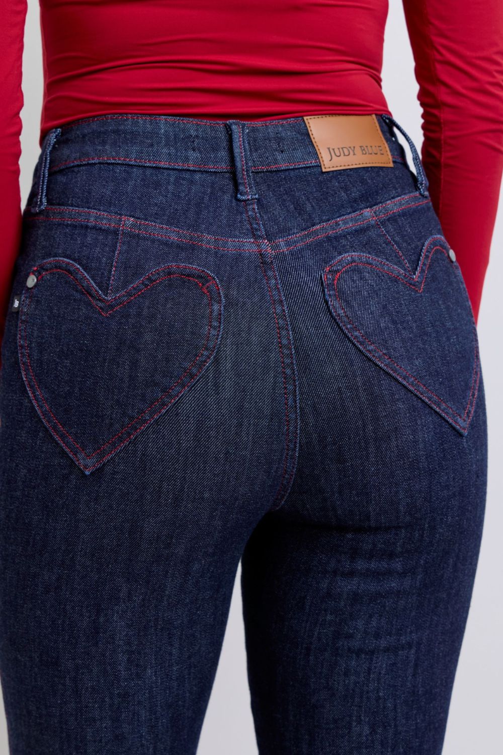 Judy Blue Full Size Heart Shaped Back Pockets Skinny JeansHigh Rise Heart-shaped back pockets on skinny jeans add a fun and playful twist to a classic style. These unique pockets can enhance your silhouette and create a flaJudy Blue Full Size Heart Shaped Back Pockets Skinny JeansJudy Blue Full Size Heart Shaped Back Pockets Skinny Jeans