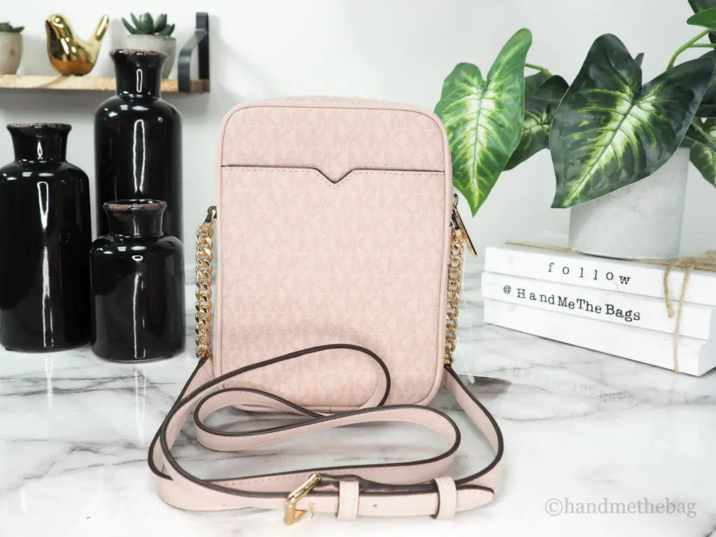 Michael Kors Jet Set Travel Medium Flight Crossbody Bag – Powder BlushTravel in style with the Michael Kors Jet Set Medium Flight Crossbody Bag in Powder Blush. Crafted from signature PVC, it features an inner slip pocket, 3 card slotsMichael Kors Jet Set Travel Medium Flight Crossbody Bag – Powder Blush PVCMichael Kors Jet Set Travel Medium Flight Crossbody Bag – Powder Blush PVC