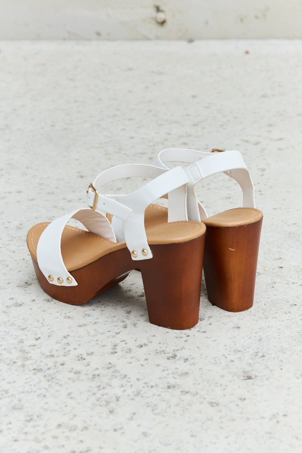 DDK Time After Time Wooden Platform Strap HeelsThese exquisite heels combine the timeless appeal of clog-style wooden platforms with the sleek sophistication of white straps, creating a unique fusion of fashion-fTime Wooden Platform Strap HeelsTime Wooden Platform Strap Heels