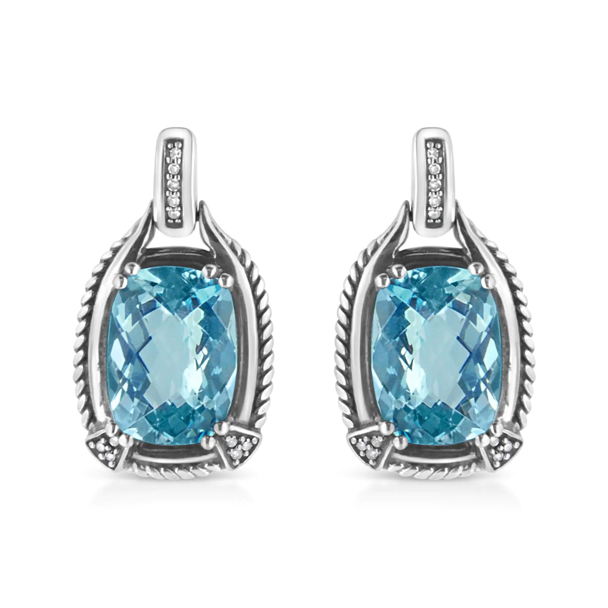 Sterling silver dangle earrings with cushion cut blue topaz and diamond accents.