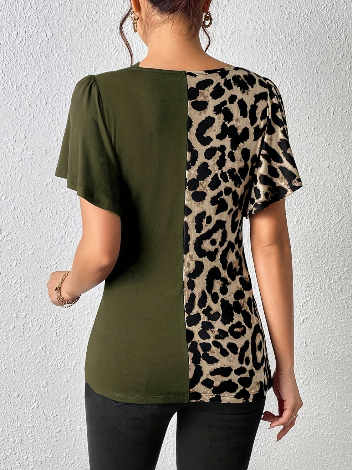 Ruched Leopard Flutter Sleeve T-ShirtIndulge in luxury with our Ruched Leopard Flutter Sleeve T-Shirt. The ruched detail and flutter sleeves add a touch of elegance to this already fierce leopard print Ruched Leopard Flutter SleeveRuched Leopard Flutter Sleeve