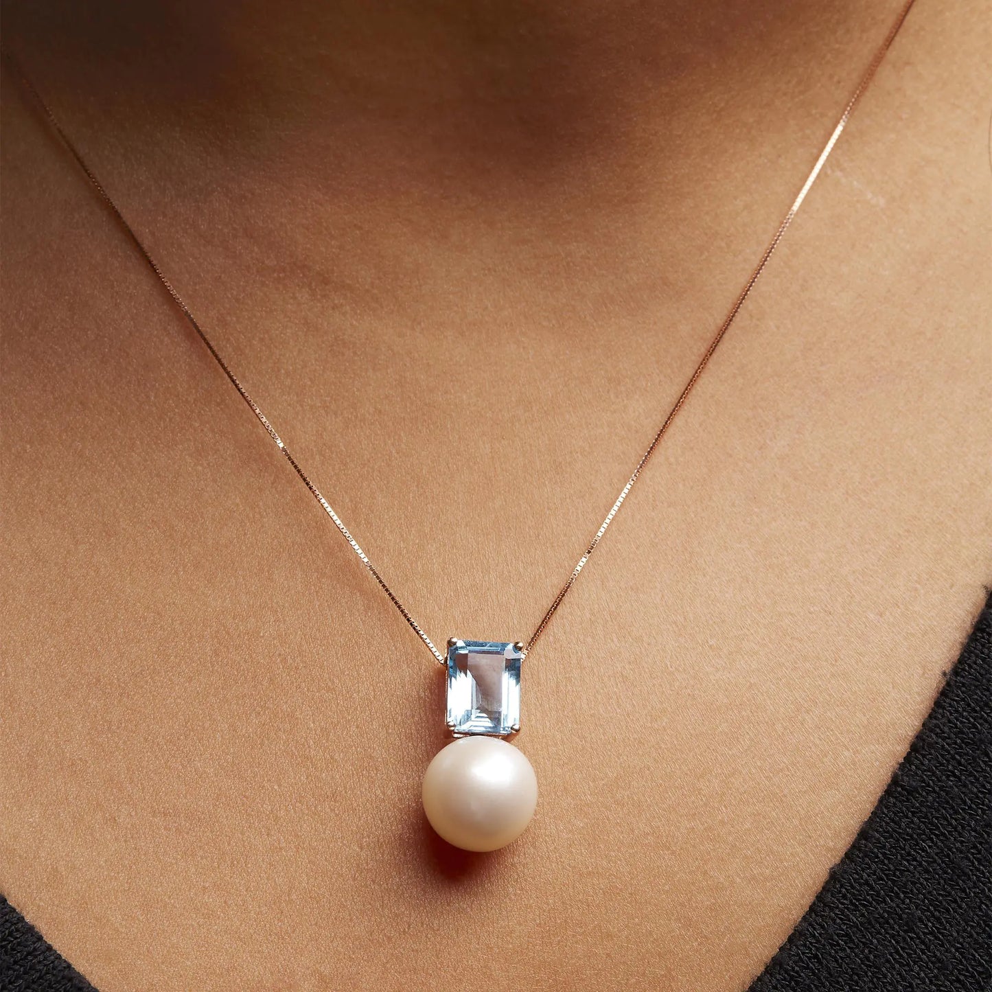 14K Rose Gold Pearl and Swiss Blue Topaz Pendant NecklaceThis exquisite 14K Rose Gold Pendant Necklace features a stunning combination of a lustrous pearl and Swiss blue topaz, totaling 3 1/3 carats. The elegant design is Swiss Blue Topaz Pendant NecklaceNecklacesSwiss Blue Topaz Pendant Necklace