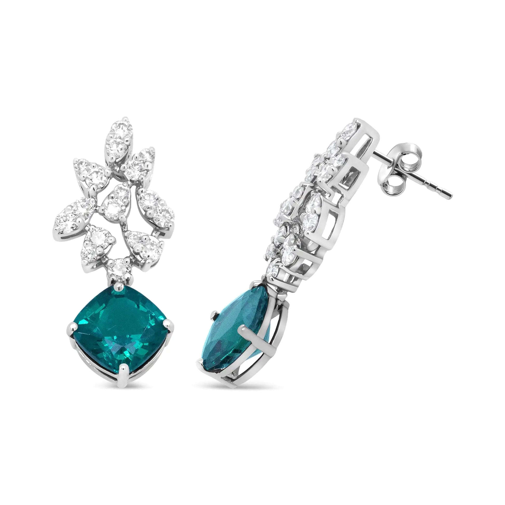 18K White Gold 1 1/10 Cttw Diamond and 7.9 x 7.7mm Green Emerald Drop Elevate your style with the rich sparkle that gleams from these gemstone and diamond drop earrings made from genuine 18k white gold. The upper dangle of this brillia7Earrings7