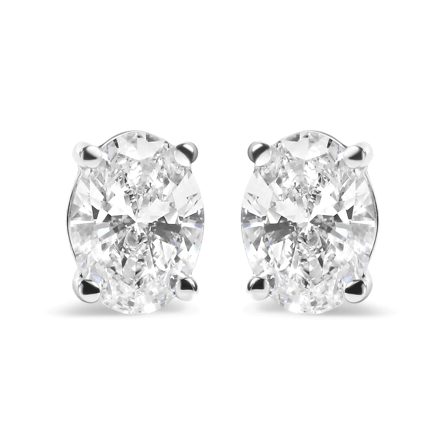 14K white gold prong set lab-grown oval diamond solitaire stud earrings with 3/4 cttw diamonds.