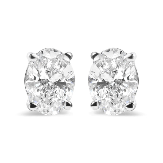 14K white gold prong set lab-grown oval diamond solitaire stud earrings with 3/4 cttw diamonds.