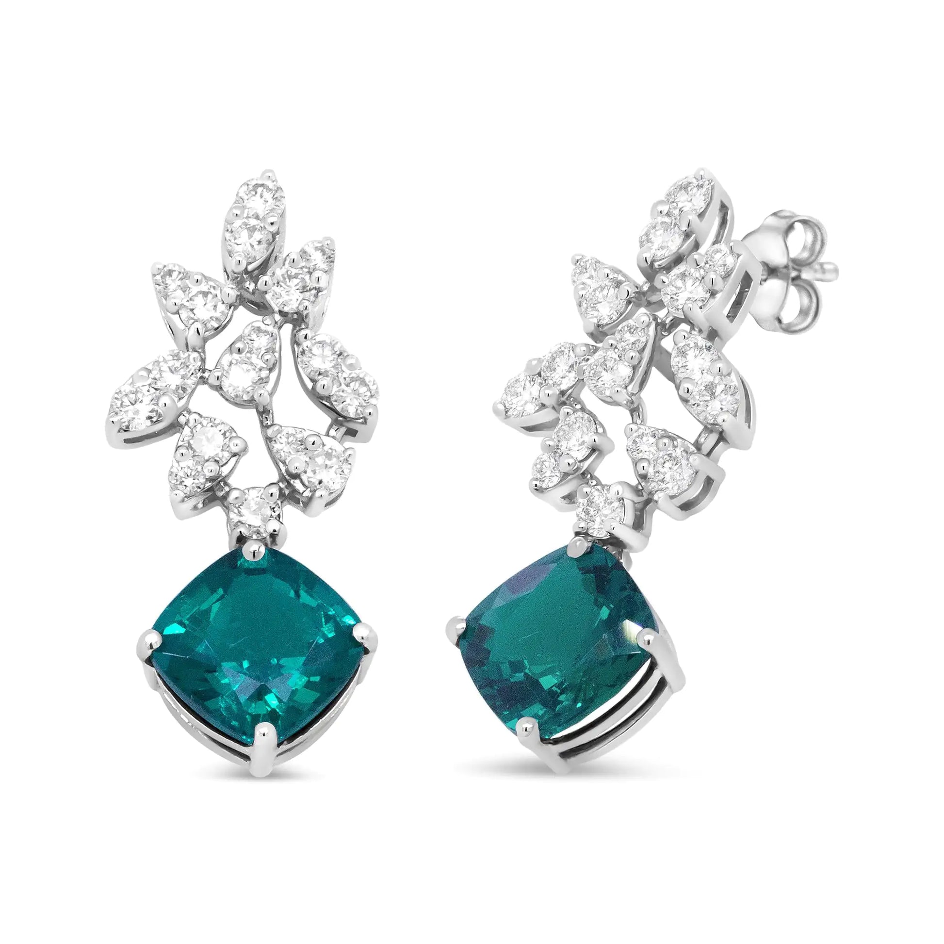 18K White Gold 1 1/10 Cttw Diamond and 7.9 x 7.7mm Green Emerald Drop Elevate your style with the rich sparkle that gleams from these gemstone and diamond drop earrings made from genuine 18k white gold. The upper dangle of this brillia7Earrings7