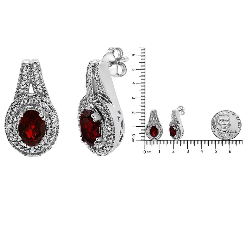 .925 Sterling Silver Diamond Accent and 8x6mm Red Oval Garnet Stud EarExuding a regal charm in deep red, this pair of fashion stud earrings is simply elegant. The bold 8*6mm oval-shaped garnet gemstone is surrounded with a pretty milgr8x6mm Red Oval Garnet Stud Earrings (8x6mm Red Oval Garnet Stud Earrings (