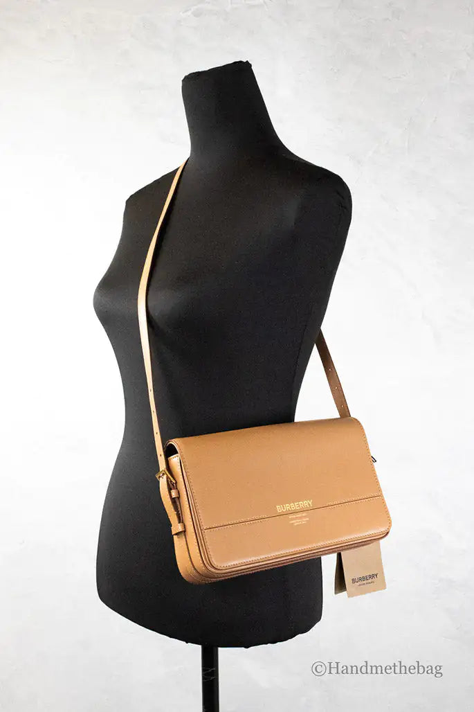 Burberry Grace Small Nutmeg Leather Flap Crossbody Clutch HandbagAdd a touch of timeless elegance to your wardrobe with the Burberry Grace Small Nutmeg Leather Flap Crossbody Clutch Handbag. Crafted from premium nutmeg-toned leathBurberry Grace Small Nutmeg Leather Flap Crossbody Clutch HandbagBurberry Grace Small Nutmeg Leather Flap Crossbody Clutch Handbag