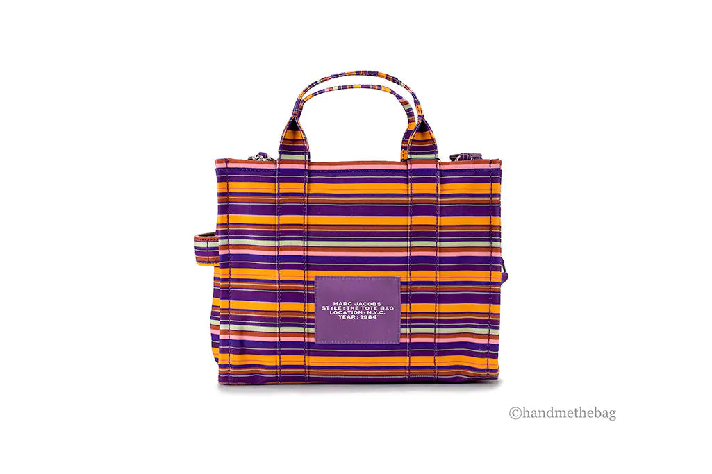 Marc Jacobs The Striped Traveler Tote Medium Purple Cotton Canvas HandMarc Jacobs The Striped Traveler Tote – Medium Purple Cotton Canvas Handbag﻿Add a pop of color to your wardrobe with Marc Jacobs The Striped Traveler Tote in medium Striped Traveler Tote Medium Purple Cotton Canvas Handbag PurseStriped Traveler Tote Medium Purple Cotton Canvas Handbag Purse