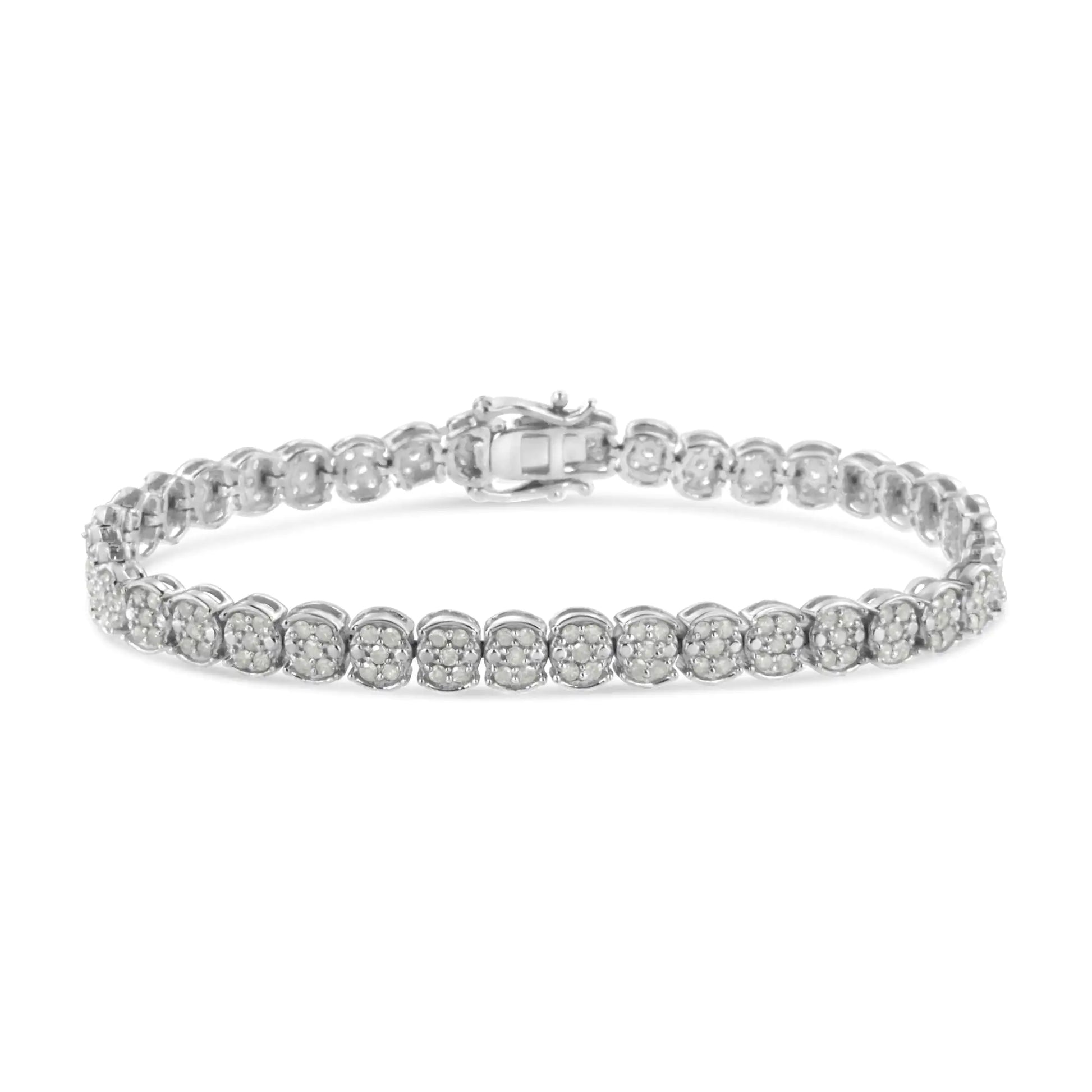 Sterling Silver Diamond Cluster Link BraceletA sparkling enchantment of diamonds creates glistening beauty in this cluster link bracelet. This bracelet radiates modern glamour, perfectly prepared with round diaSterling Silver Diamond Cluster Link BraceletSterling Silver Diamond Cluster Link Bracelet