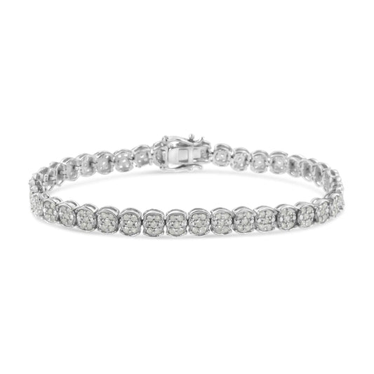 Sterling Silver Diamond Cluster Link BraceletA sparkling enchantment of diamonds creates glistening beauty in this cluster link bracelet. This bracelet radiates modern glamour, perfectly prepared with round diaSterling Silver Diamond Cluster Link BraceletSterling Silver Diamond Cluster Link Bracelet