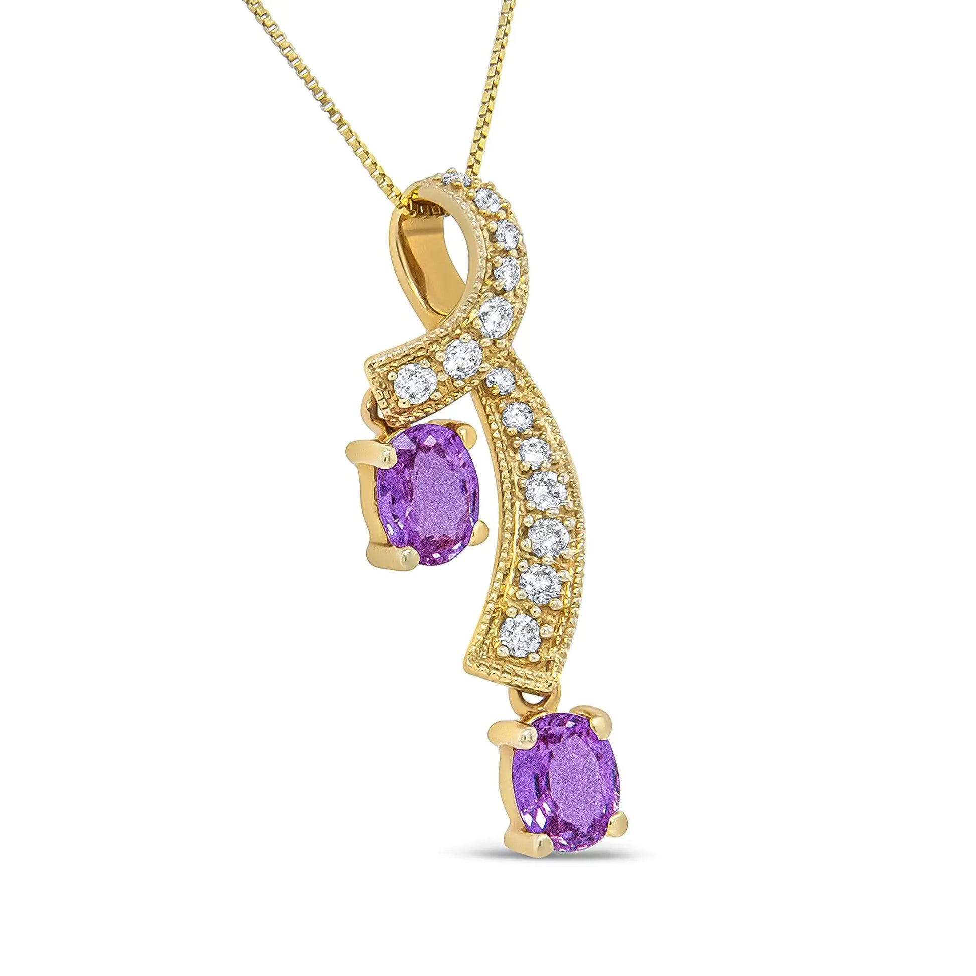 14K Yellow Gold 6x4mm Oval Pink Sapphire and 1/5 Cttw Round Diamond PeThis unique pendant necklace is sure to turn heads. The pendant features a a ribbon of diamond accented 14K Yellow Gold weaving through down neckline. The diamond st14K Yellow Gold 6x4mm Oval Pink Sapphire14K Yellow Gold 6x4mm Oval Pink Sapphire