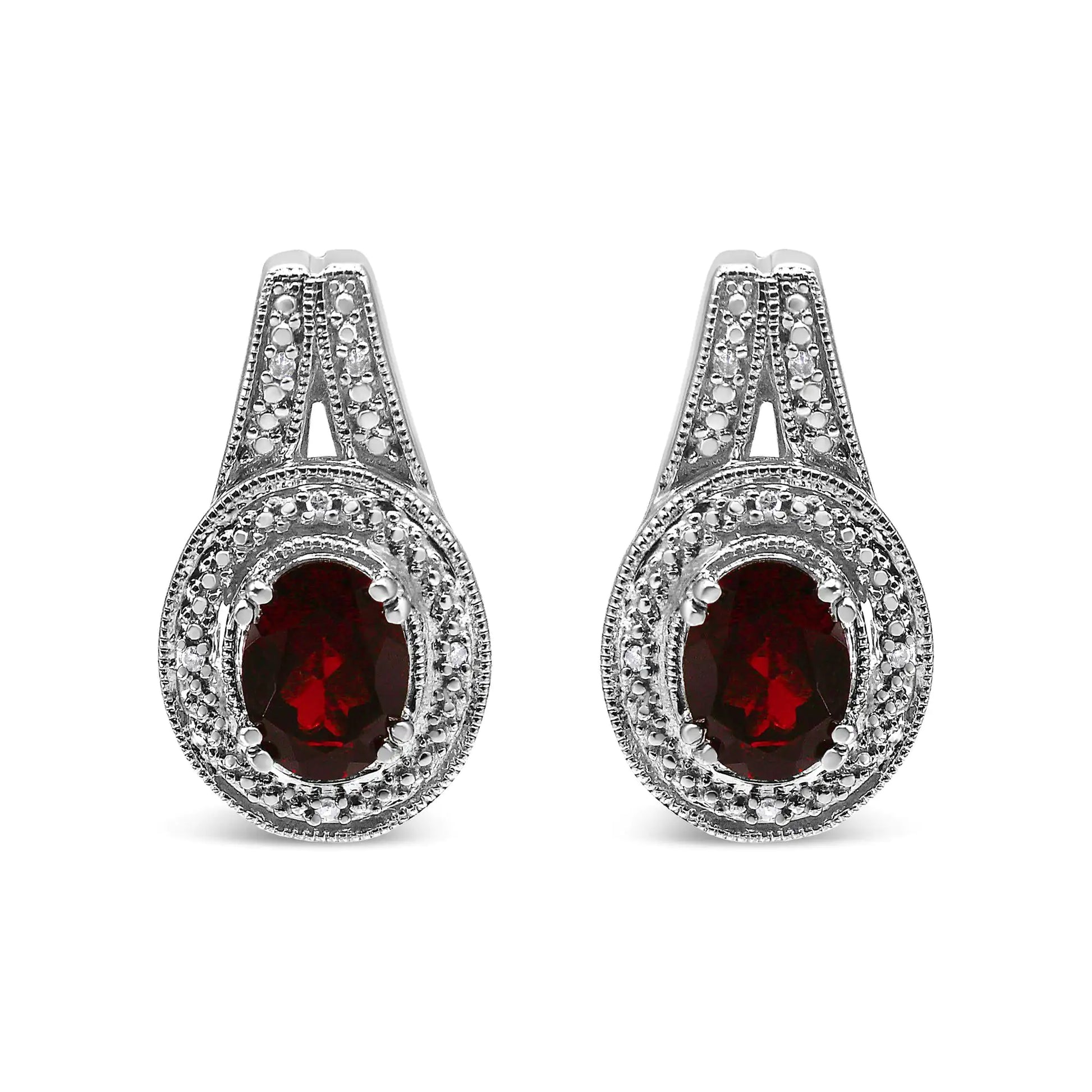 .925 Sterling Silver Diamond Accent and 8x6mm Red Oval Garnet Stud EarExuding a regal charm in deep red, this pair of fashion stud earrings is simply elegant. The bold 8*6mm oval-shaped garnet gemstone is surrounded with a pretty milgr8x6mm Red Oval Garnet Stud Earrings (8x6mm Red Oval Garnet Stud Earrings (