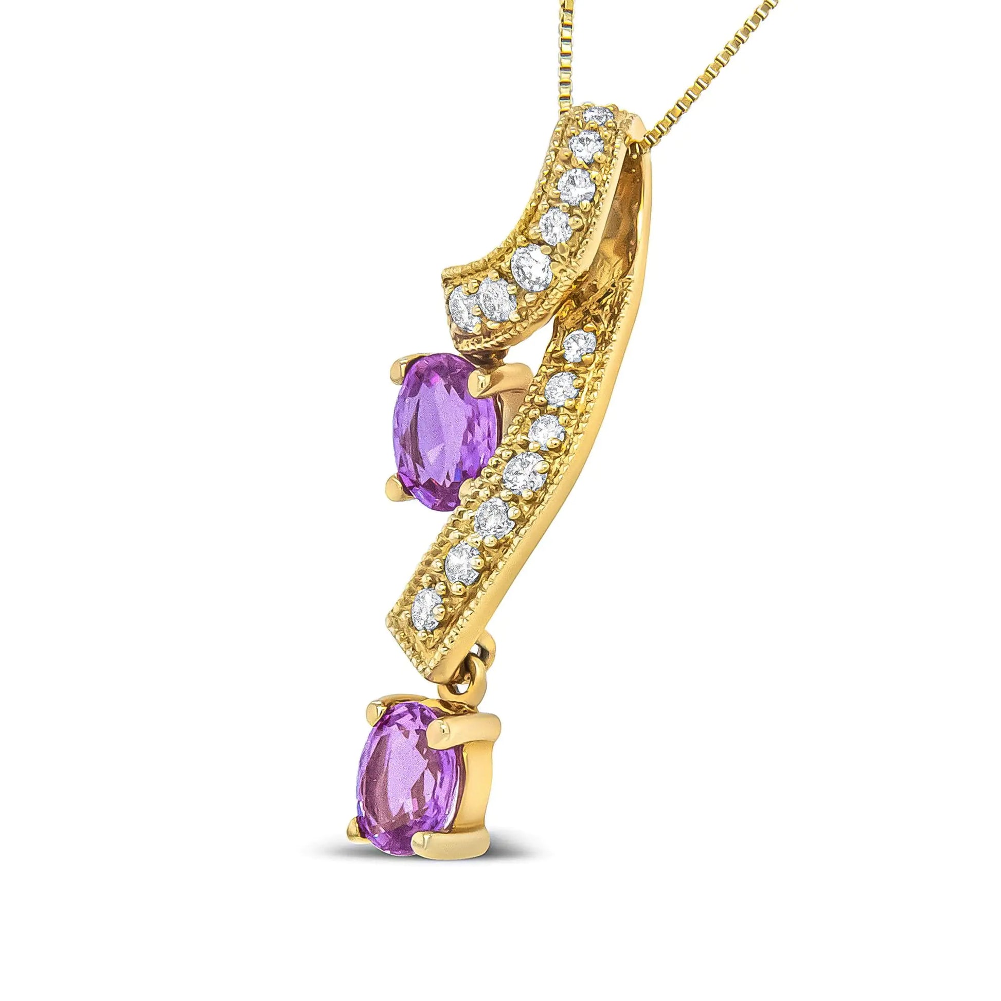 14K Yellow Gold 6x4mm Oval Pink Sapphire and 1/5 Cttw Round Diamond PeThis unique pendant necklace is sure to turn heads. The pendant features a a ribbon of diamond accented 14K Yellow Gold weaving through down neckline. The diamond st14K Yellow Gold 6x4mm Oval Pink Sapphire14K Yellow Gold 6x4mm Oval Pink Sapphire