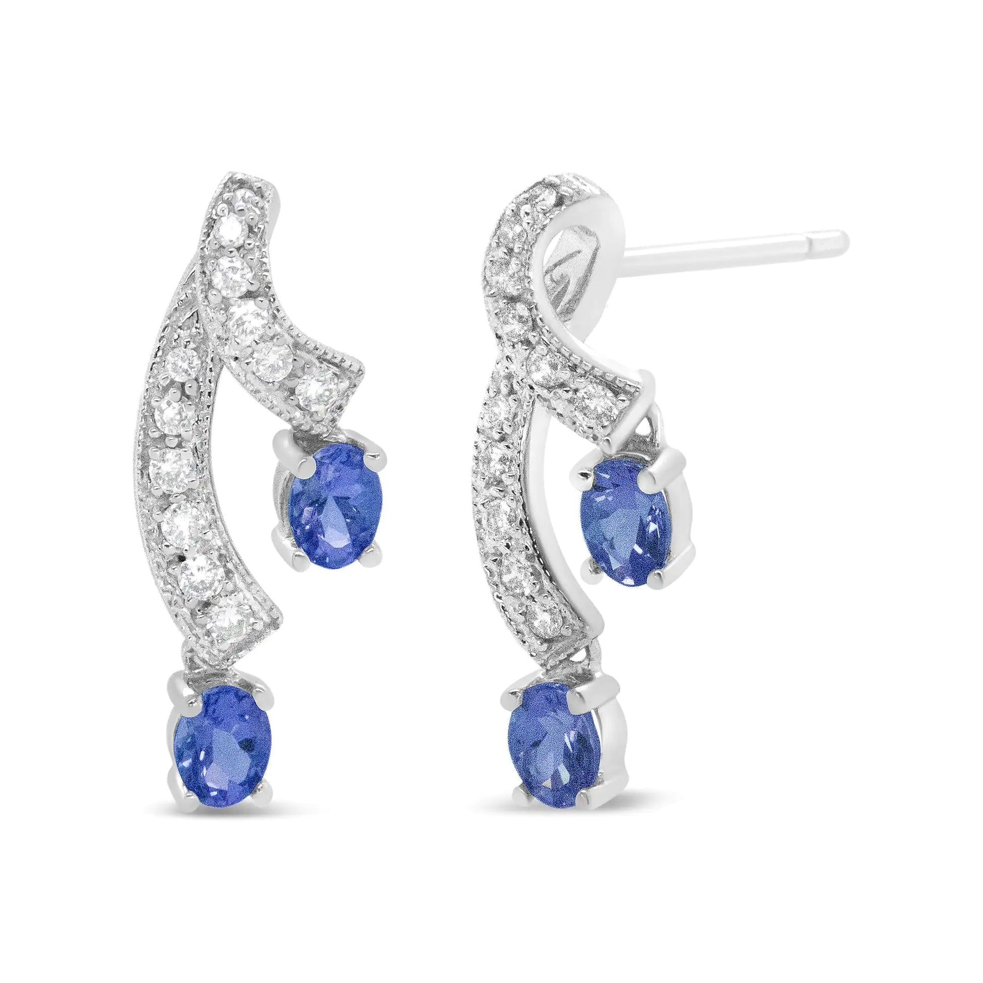 14K White Gold Ribbon Twist Tanzanite and Diamond Drop Earrings – ElegExperience the perfect blend of elegance and color with these 14K White Gold Ribbon Twist Tanzanite and Diamond Drop Earrings. The exquisite tanzanite gemstones are 14K White Gold Ribbon Twist TanzaniteEarrings14K White Gold Ribbon Twist Tanzanite