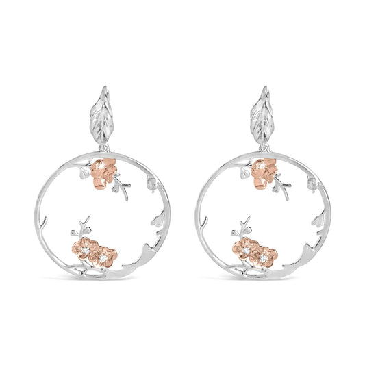 Rose gold plated sterling silver diamond floral hoop earrings.