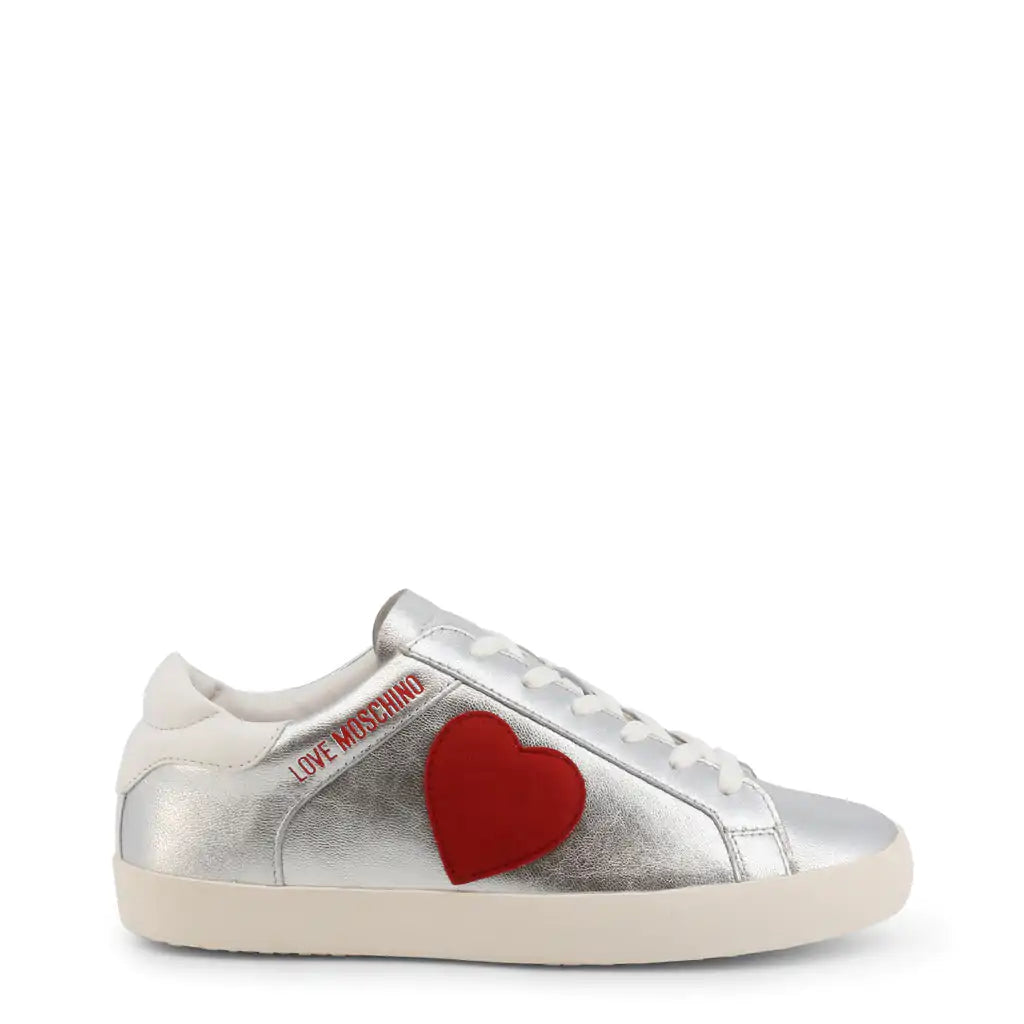 Silver Heart SneakersStrut your stuff in these Love Moschino silver heart sneakers.  These logo shoes feature a red heart on the side.Add a touch of sparkle to your stride with our SilveSilver Heart SneakersSilver Heart Sneakers