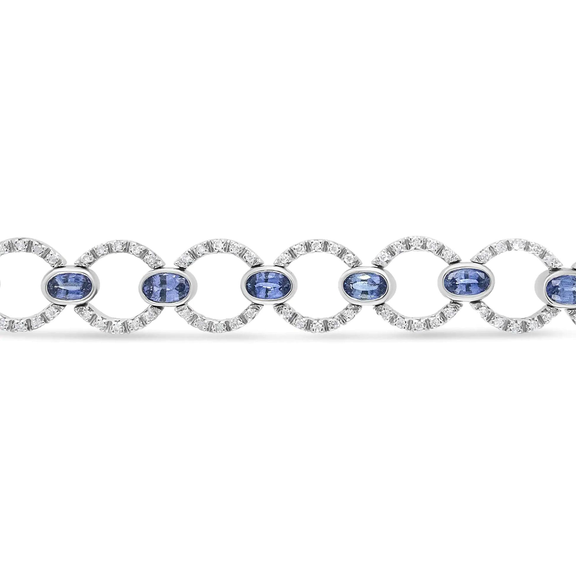 18K White Gold 6 Cttw Diamond and 5x3mm Oval Blue Sapphire Openwork CiThis luxury18k white gold link bracelet showcases a shimmering circle links set with glorious round white diamonds in prong settings. These sparkling stones total 6 5x3mm Oval Blue Sapphire Openwork Circle Link Bracelet 5x3mm Oval Blue Sapphire Openwork Circle Link Bracelet 